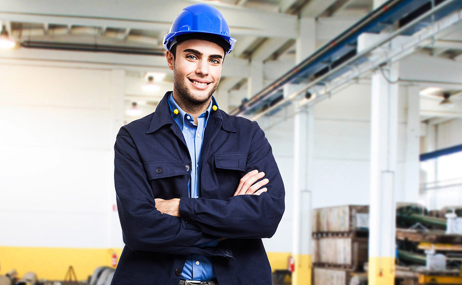 Worker holding his helmet